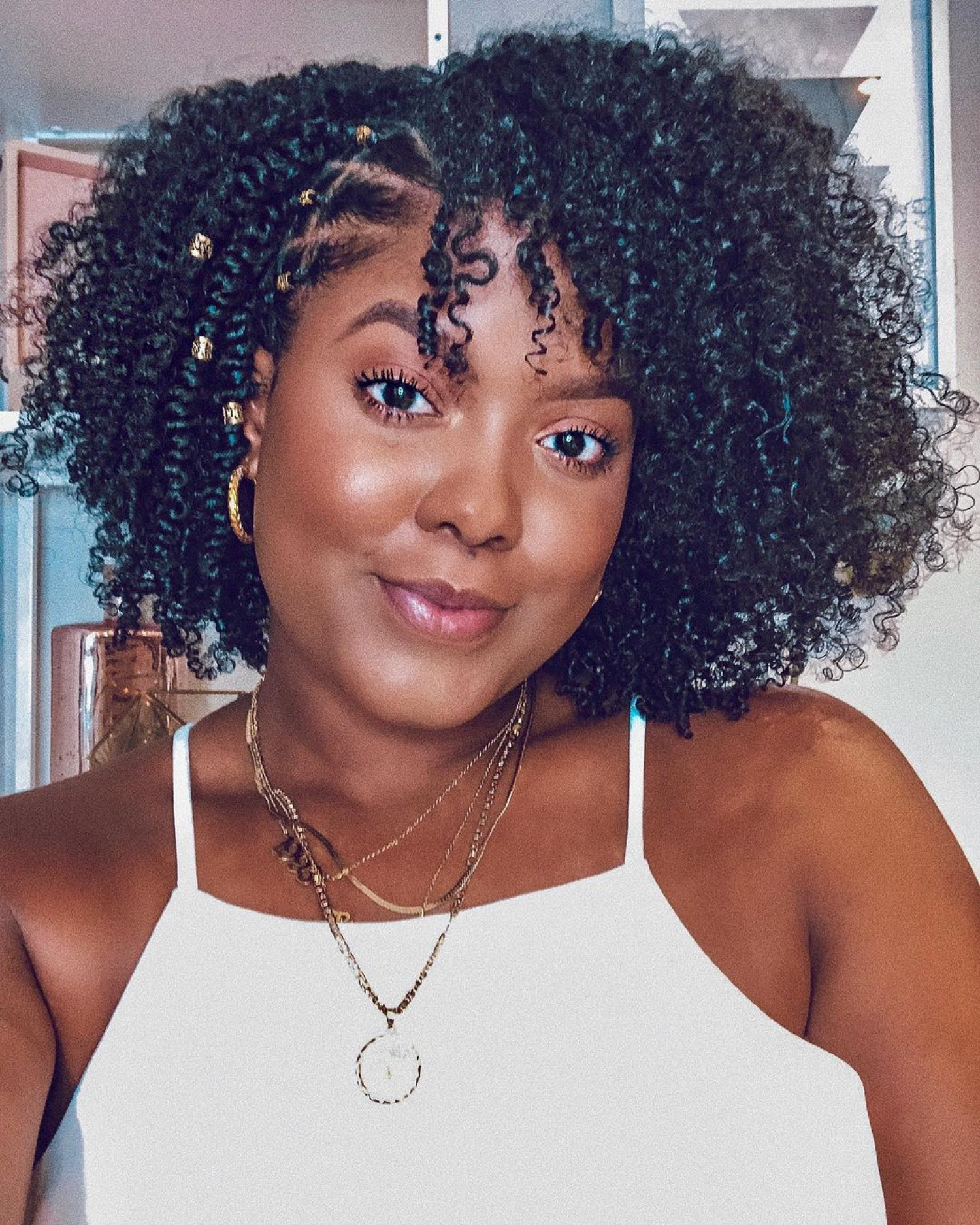 Trança Nagô vs. Trança Embutida: Qual o Melhor Estilo para Cabelos Cacheados?